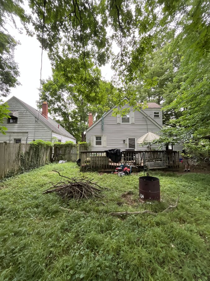 Columbus OH home before — overgrown yard facing foreclosure