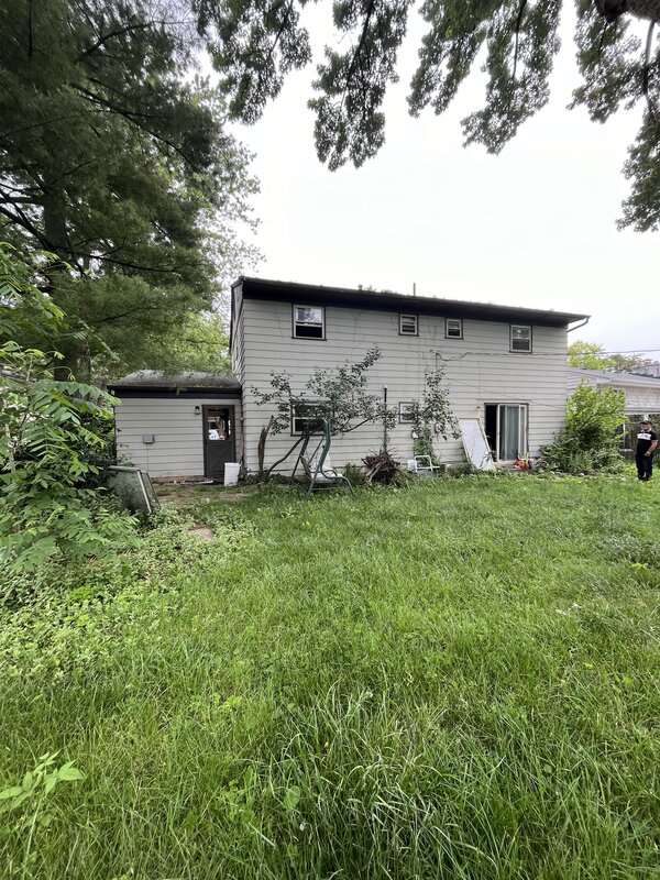 Columbus home before — rear of property showing deferred maintenance