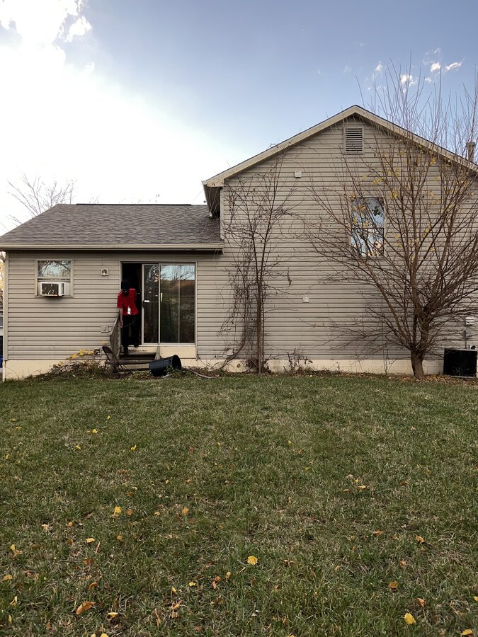 Columbus OH home before — rear exterior vacant for 8 years after water damage